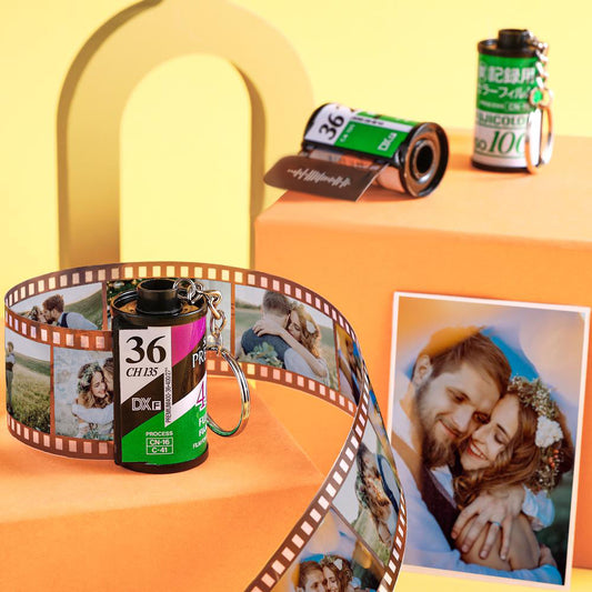 Green personalised scannable music code photo film roll keyring showing film-strip photos and the scannable music code on the film head