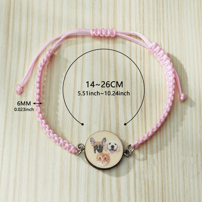 Personalised pet portrait bracelet with wooden pendant showing pet photo on an adjustable braided rope