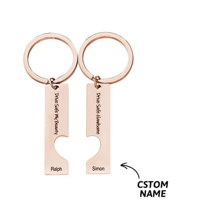 Close-up of engraved 'Drive Safe' motif and personalised text on a stainless steel couple keyring – custom engraving detail