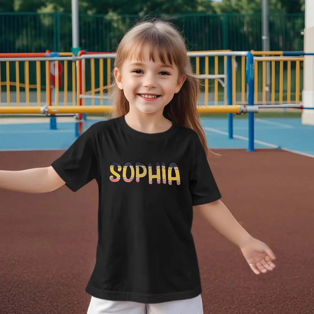 Close-up of personalised pencil print and stitched polyester fabric on kids' school T‑shirt