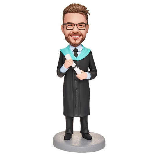 Personalised graduation boy bobblehead holding an engraved certificate, polymer clay figure with customised hair and smiling expression, ideal keepsake