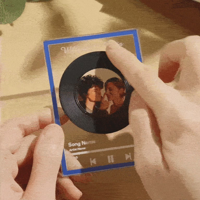 Close-up of custom engraved message and uploaded photo on a personalised NFC vinyl record plaque — bespoke music keepsake