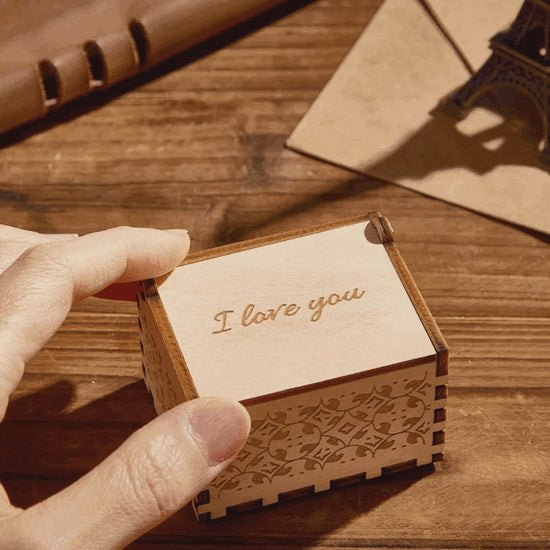 Personalised digital photo music box on a bedside table — a sentimental wooden keepsake gift for anniversaries, Mother's Day or memorials