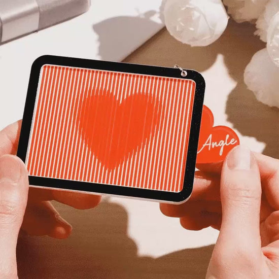 Pull-out action of red heart keyring revealing glittering inner heart — personalised keepsake, custom engraved romantic gift for her
