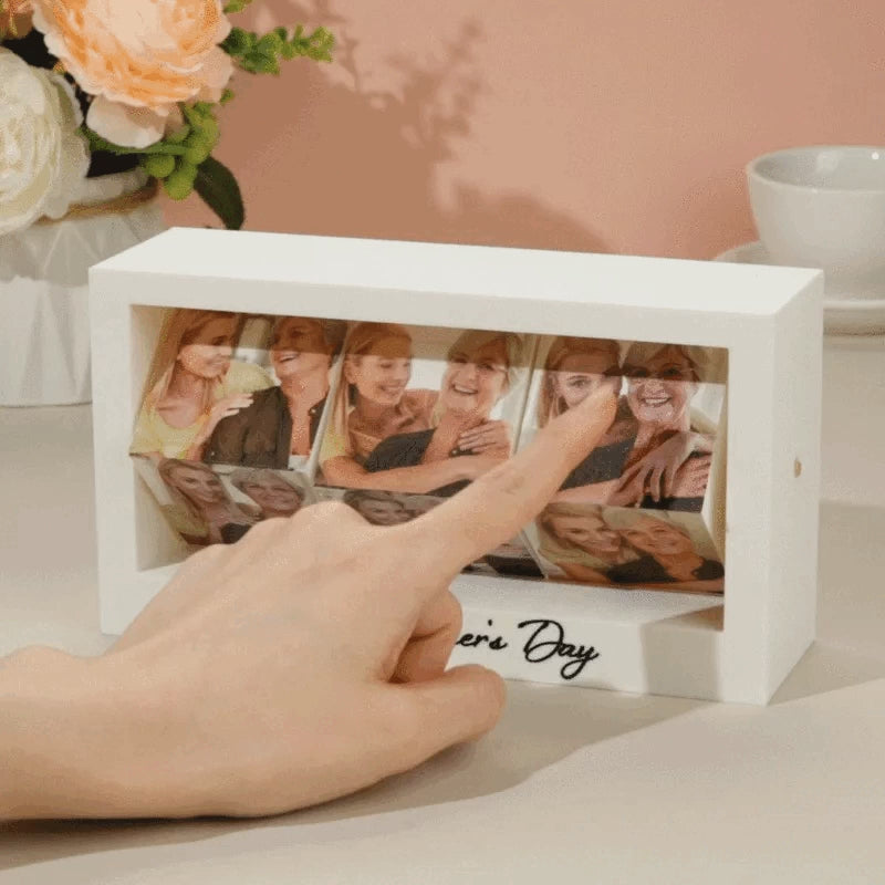 Rotating photo frame cube on a desk with family pictures visible – compact personalised keepsake (W15cm x H11cm x D6cm) ideal as an anniversary or memorial gift for her